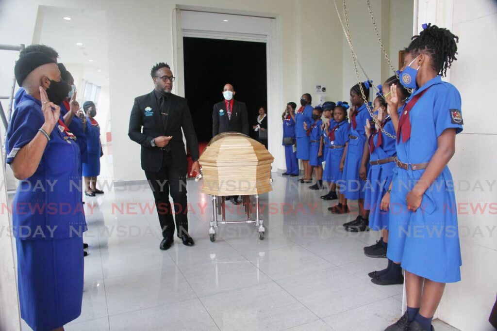 A Girls Guide guard of honour for former Girls Guides Association head and NAR government minister Jennifer Johnson at her funeral on Thursday at SAPA, San Fernando.