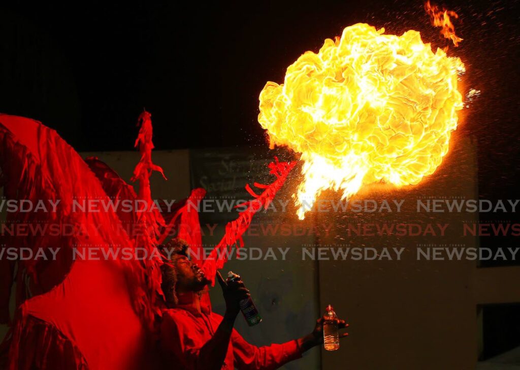 FIRE!!
Red jab jab Ricardo Felician displays Red Fireball Demon from Hell at the tradition mas competion at the St James Amphitheatre on Wednesday evening. Photo by Andrea De Silva