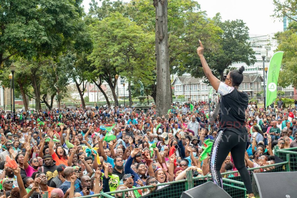 LOOK AT PEOPLE: Thousands packed Woodford Square for bmobile's Soca in bsquare show on Thursday. Here they are entertained by soca diva Fay-Ann Lyons-Alvarez. 