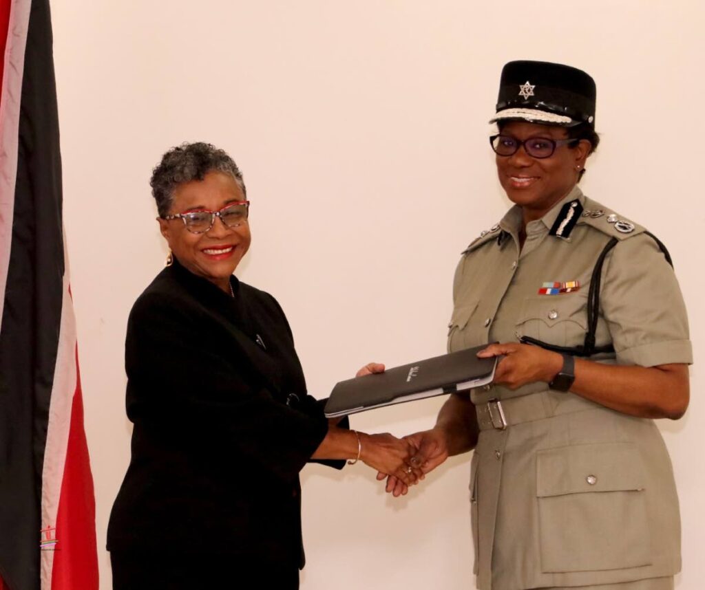 Chairman of the Police Service Commission retired judge Judith Jones presents Commissioner of Police Erla Harewod-Christopher with her letter of promotion on Friday at PSC office Pasea Street, Tunapuna. - Photo courtesy Police Service Commission