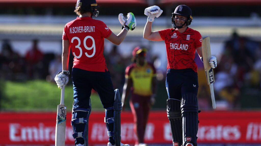 Heather Knight and Nat Sciver-Brunt of England celebrate following the ICC Women's T20 World Cup group B match against the West Indies at Boland Park on Saturday in Paarl, South Africa. - via ICC