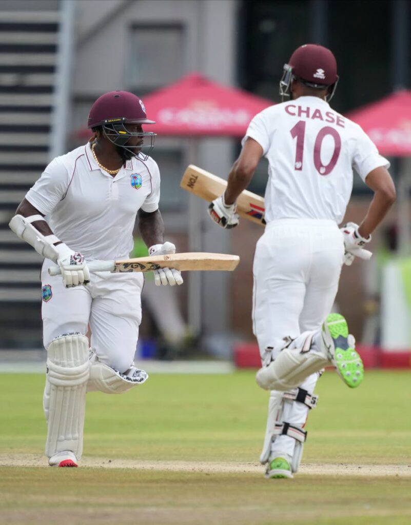 West Indies batsman Kyle Mayers (L) and Roston Chase make a quick run on the second day of the second Test against Zimbabwe at Queens Sports Club in Bulawayo, Zimbabwe, on Monday. AP Photo - 