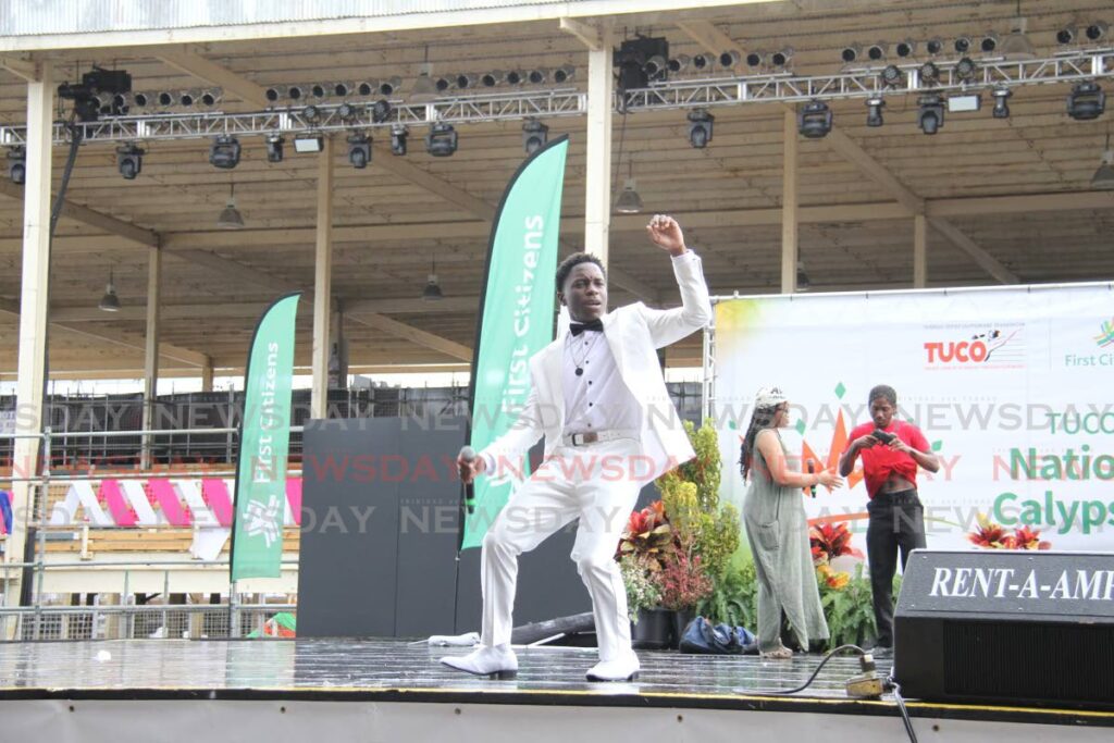 Marcus McDonald, of Presentation College, San Fernando, during his winning performance at the FCB Junior Calypso Monarch competition at the Queen's Park Savannah, Port of Spain on Monday. - Ayanna Kinsale