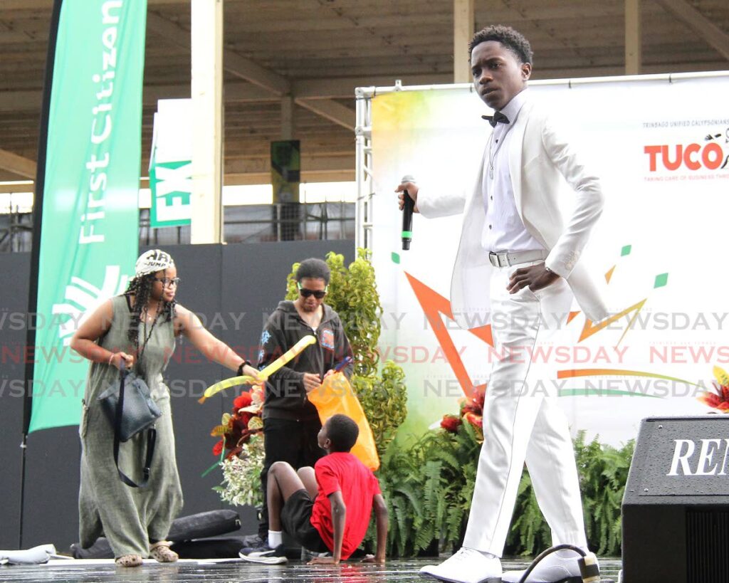 Marcus Mc Donald of Presentation College, San Fernando sings his winning song Don't Spoil Them during the Junior Calypso Monarch competition at the Queen's Park Savannah, Port of Spain.  - AYANNA KINSALE