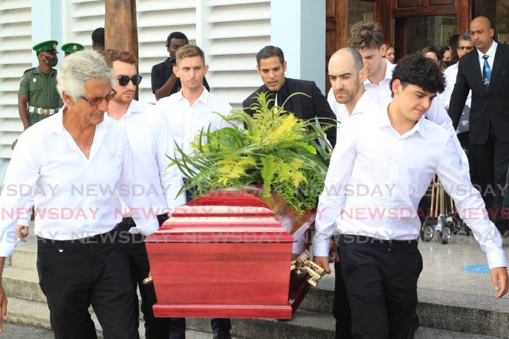 Pallbearers carry the body of Sidney Knox, former Neal & Massy executive and RAF veteran who served in World War II, at his funeral at the Church of the Assumption, Long Circular Road, Maraval, on Wednesday. - ROGER JACOB