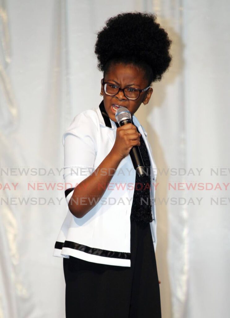 Nyla Hamilton from Point Fortin RC sings Bring it Back at the San Fernando Carnival Committee, Junior Calypso Monarch primary school finals at City Hall, San Fernando, on Wednesday. - Lincoln Holder