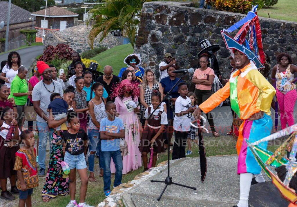 Tyreese Montano, right, gives an entertaining speech at the Traditional Carnival Living Museum. Photo by David Reid