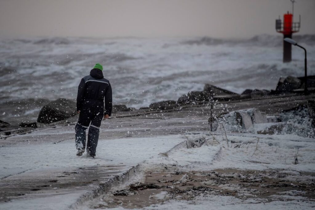 A man walks on the shore during a storm in Thorsminde in West Jutland, Denmark, on February 17. A powerful storm over the North Sea hit northern Europe as the Danish Meteorological Institute forecast hurricane-force wind gusts. AP Photo - 