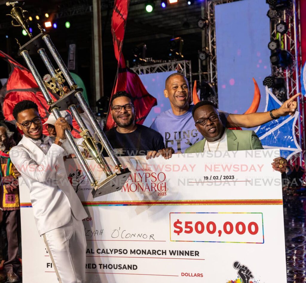 Calypso Monarch Duane Ta'zyah O'Connor with his first place trophy at the Dimanche Gras, Queen's Park Savannah, Port of Spain on February 19.  - JEFF K. MAYERS