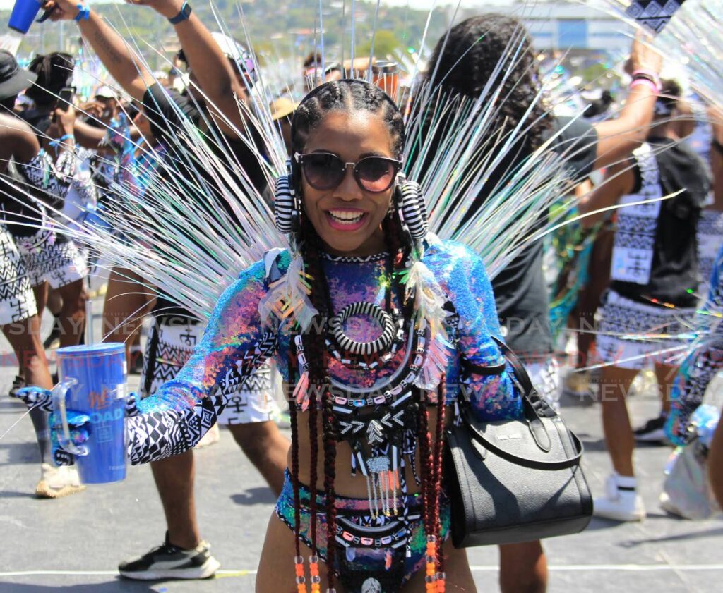 A masquerader from Lost Tribe's 202WE as she crossed the Queen's Park Savannah stage in Port of Spain on Carnival Tuesday. - AYANNA KINSALE