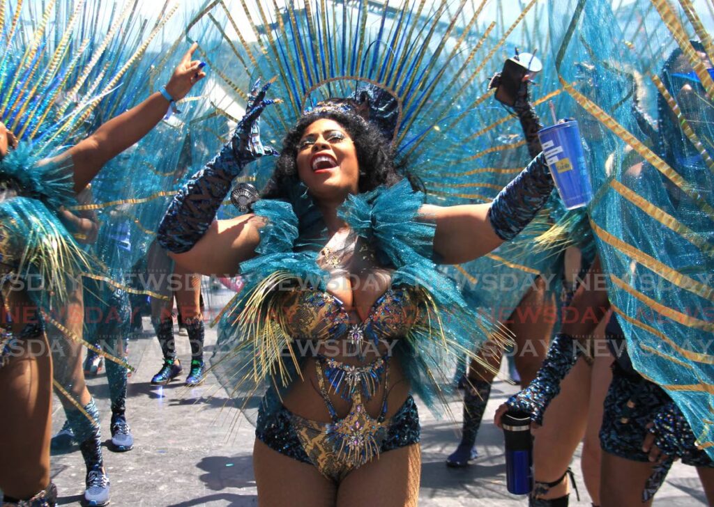 A masquerader from The Lost Tribe, plays her mas at the Queen's Park Savannah on Carnival Tuesday. The NCC said on Thursday that Lost Tribe was Band of the Year. Photo by Ayanna Kinsale