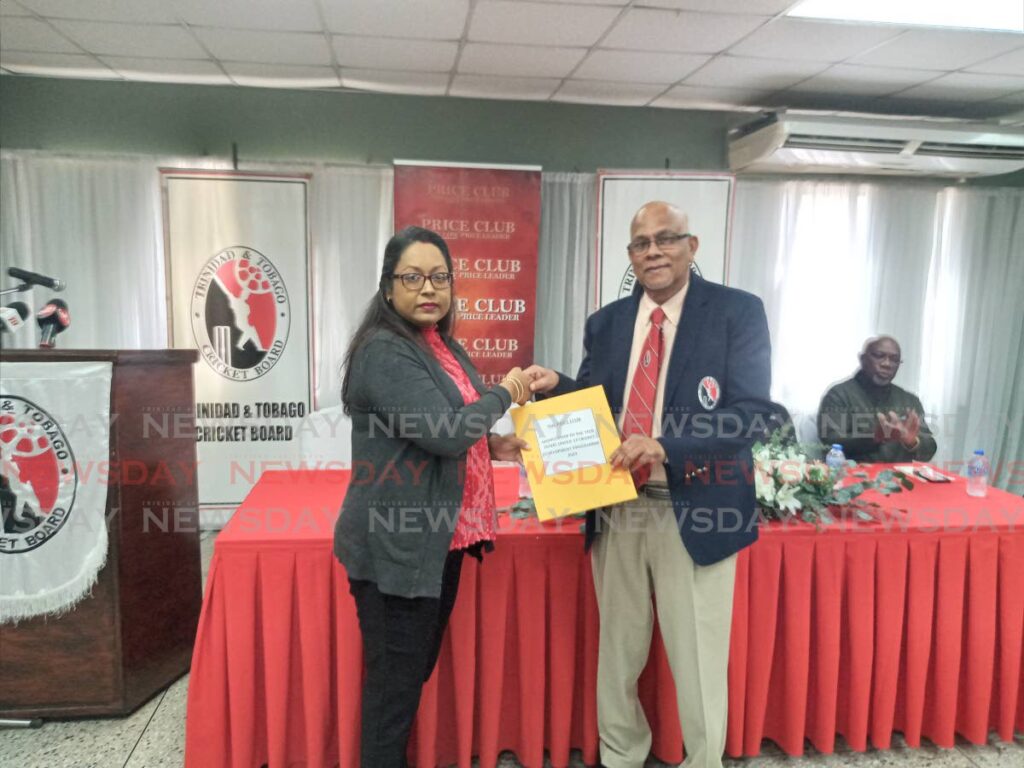 Public relations officer and human resources officer Rianna Pancham-Sony of Price Club Supermarket presents a cheque to president of the TT Cricket Board Azim Bassarath. - Jelani Beckles