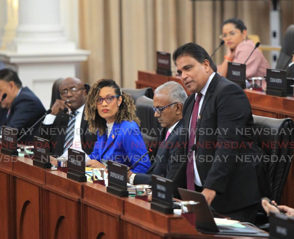 Oropouche East MP Dr Roodal Moonilal addresses the Lower House on Friday. From left, are MPs Rodney Charles, Khadijah Ameen and Rudranath Indarsingh. - AYANNA KIINSALE