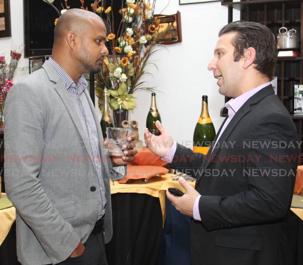 Manuel Rodrigues, ITD sales director (Caribbean) at Schneider Electric chats with Vijay Jagassar, business development manager at Massy Wood Group, at a function highlighting Massy Technologies InfoCom partnership with Schneider Electric, Jaffa Restaurant, Queen's Park Oval. Port of Spain, on February 22, 2019. Photo by Roger Jacob