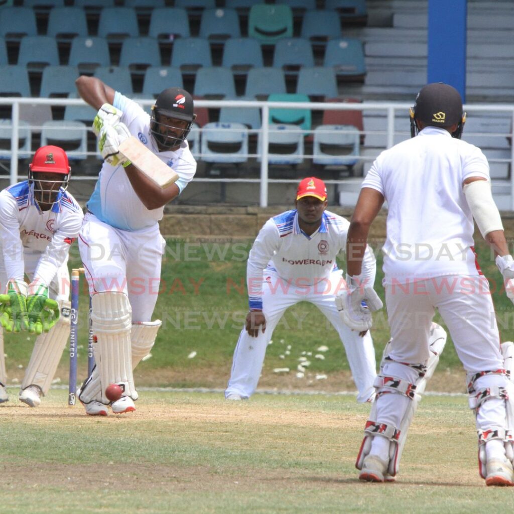 Queen's Park Cricket Club batsman Jyd Goolie hits a shot against defending champions PowerGen Penal Sports Club, at the Queen's Park Oval, Port of Spain on Sunday. - Angelo Marcelle