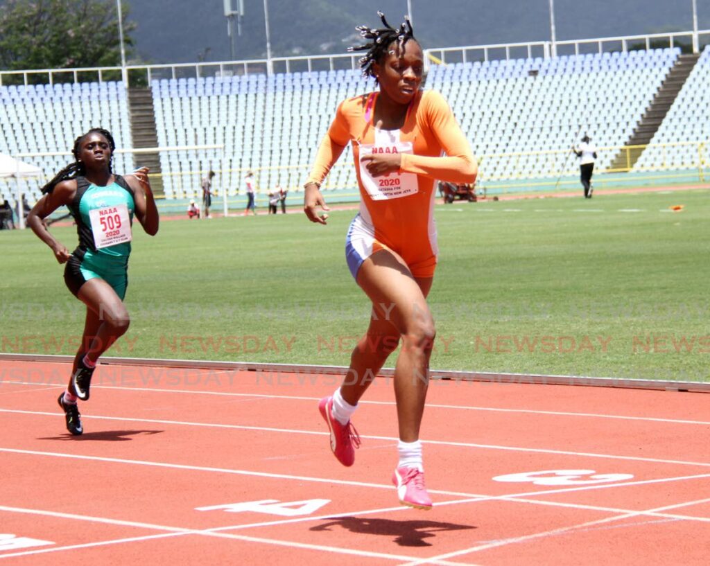 (FILE): In this March 21, 2021 file photo Ponit Fortin New Jets' Natasha Fox crosses the finish line in the under-20 400 dash during the NAAA Track and Field series at the Hasely Crawford Stadium, Port of Spain. - 