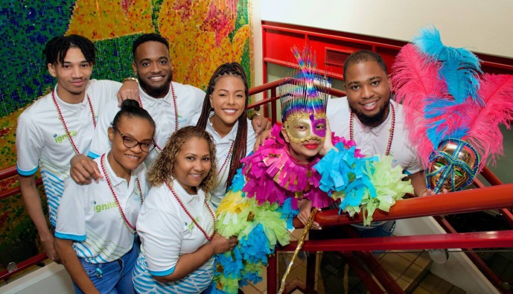 The Pierrot grenade poses for a photo with the customer service and policy administration teams: back, from left, Nicolai Brown; Hakeem John, Kella Awai, Aaron Bon, and front, from left, Renelle Orr and Stacey-Ann Pilgrim.- 