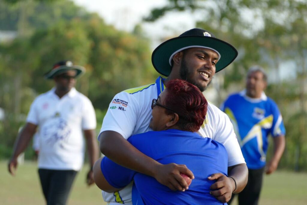 Presentation College San Fernando all-rounder Khaleem Mohammed is embraced by his mother after leading his school to victory against Fatima College in the SSCL on Tuesday.  - 