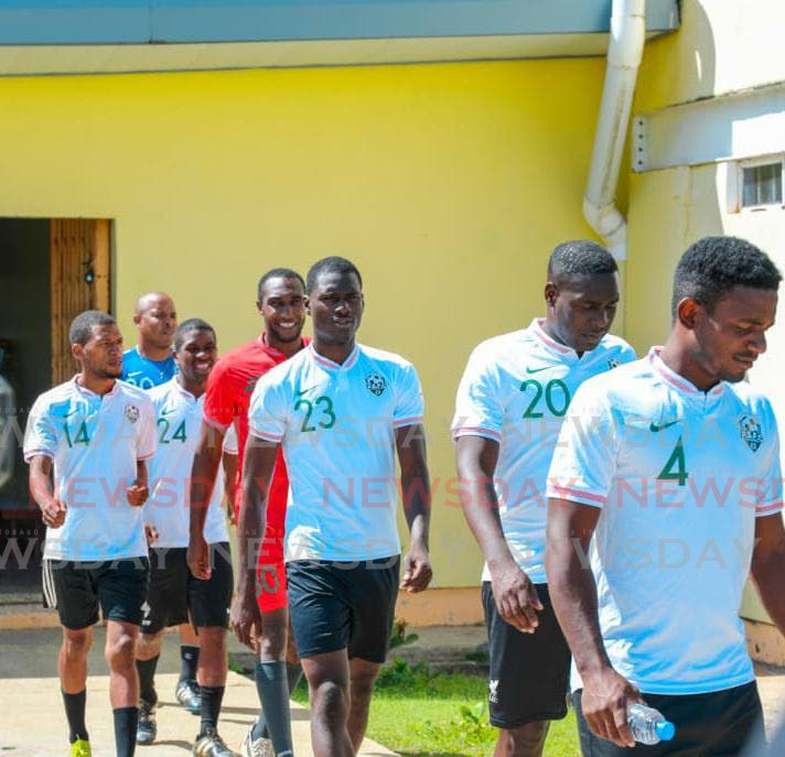 Prisons FC players before starting a training session recently at the Youth Training and Rehabilitation Centre in Arouca. - 