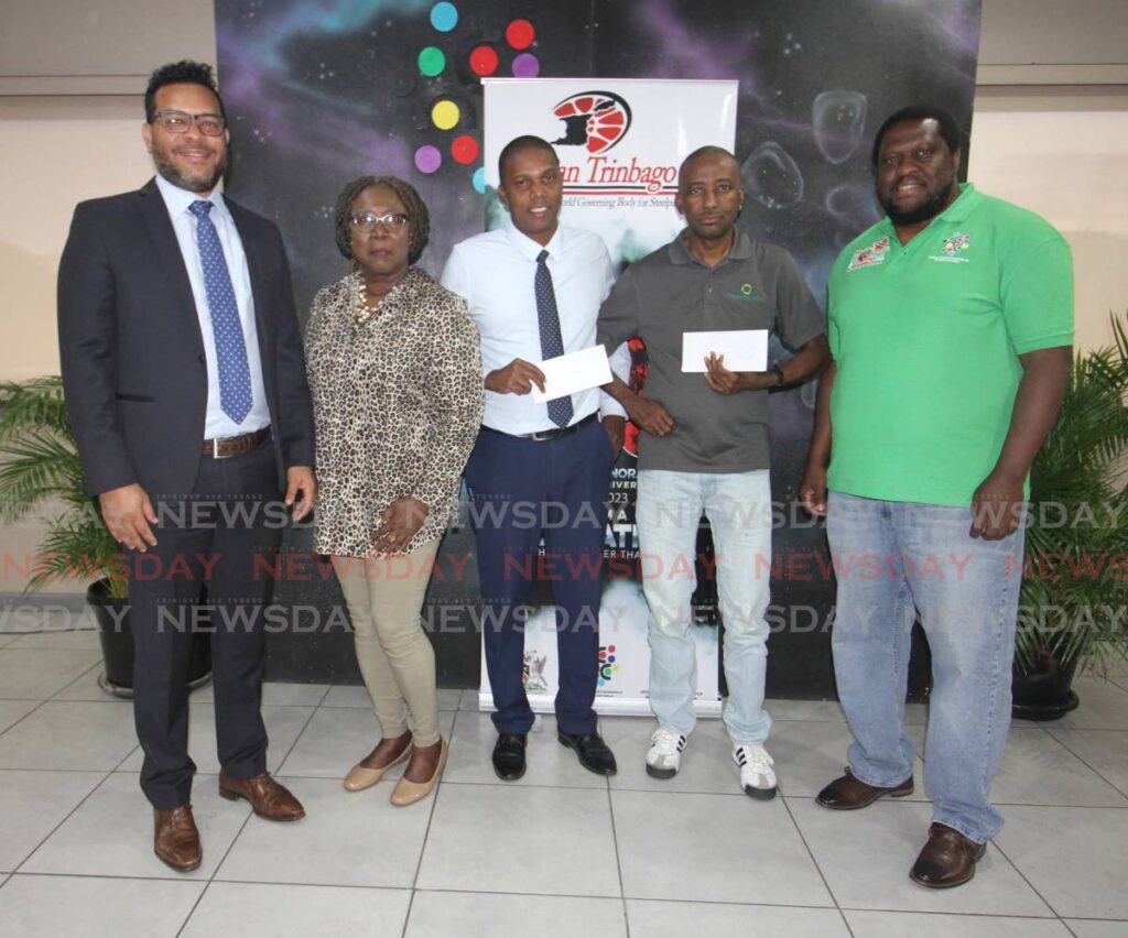 From left, Minister of Tourism, Culture and the Arts Randall Mitchell and PanTrinbago president Beverley Ramsey-Moore, with  Myles Phillips of Tropical Angel Harps (small bands winner), Edmund willis of BP Renegades (large bands winner) and National Carnival Commission CEO Nigel Williams on right,  at the 2023 Panorama prize giving ceremony at the Queen's Park Savannah VIP Lounge on Thursday. Photo by Angelo Marcelle