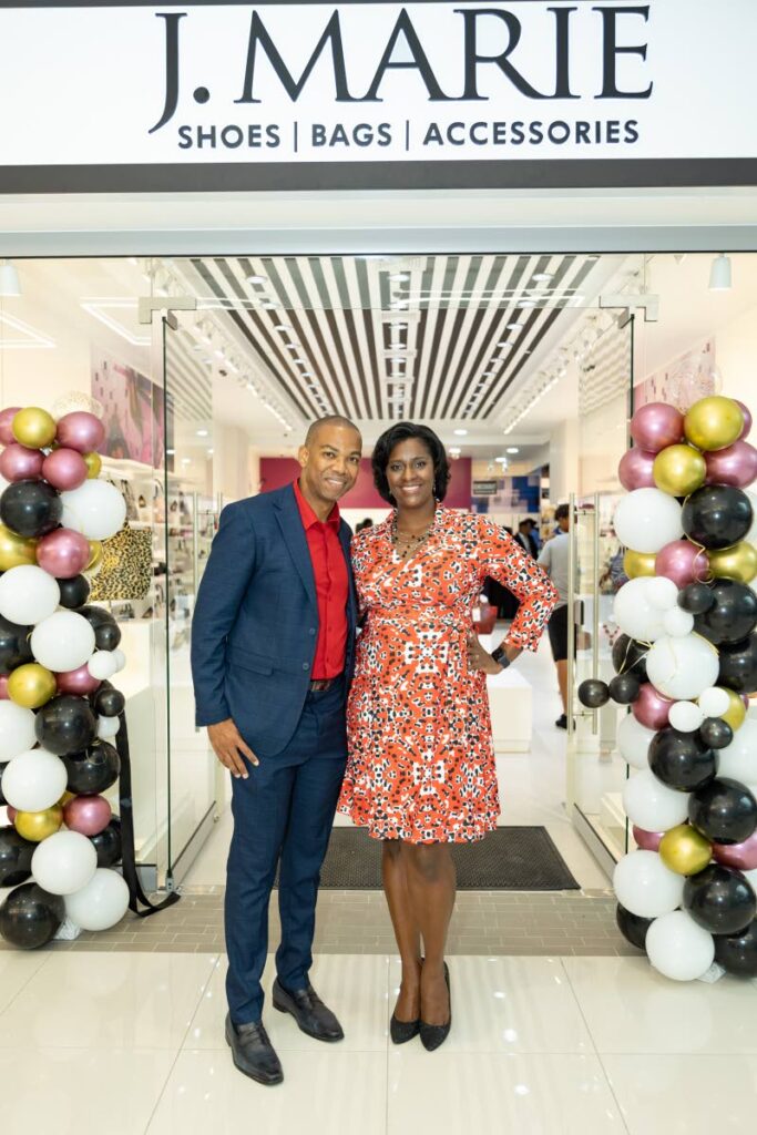 Joanna James, right, with her husband Keron James at the opening of their new store at East Gate Mall, Trincity. - 