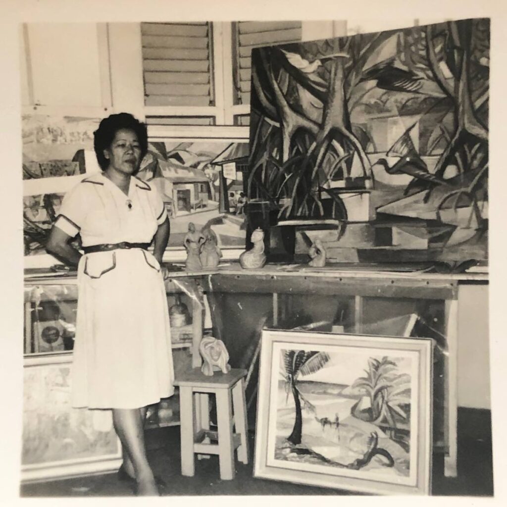 Artist Sybil Atteck in her studio with some of the artwork. - 