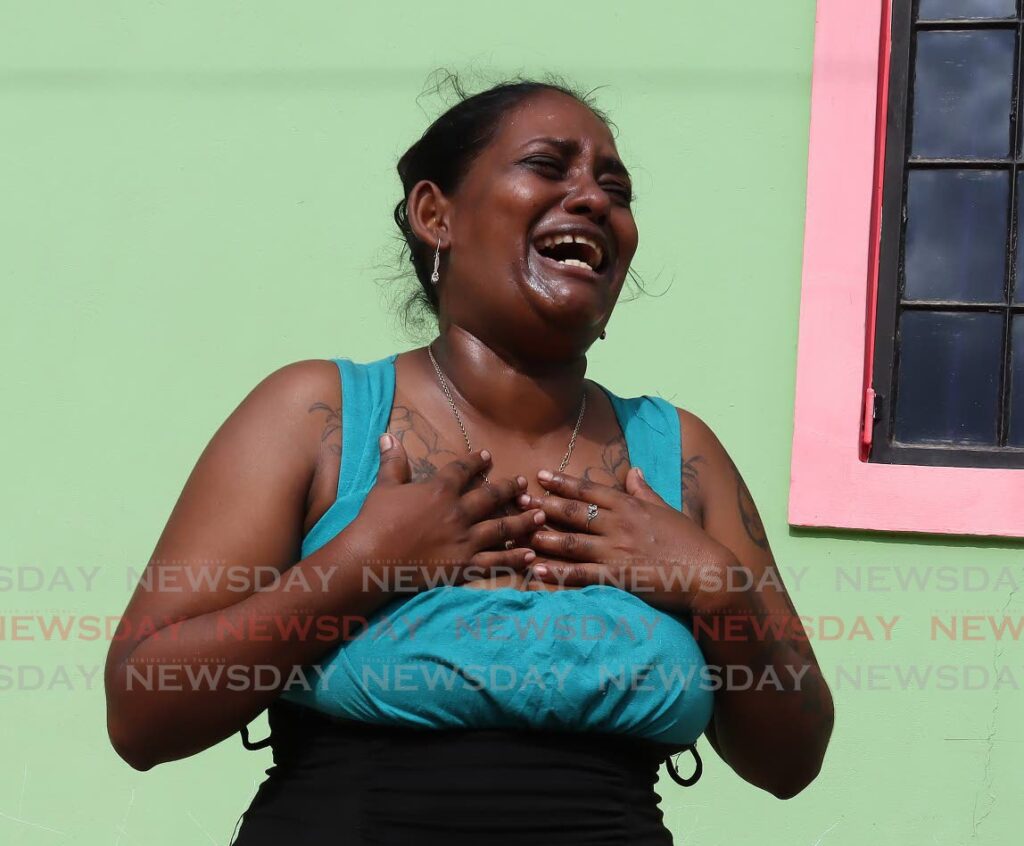 Neesha Ramkissoon is overwhelmed by grief as she speaks to Newsday about the fatal shooting death of her sister, Aneesa Ramkissoon, a mom of three, at her home at Trainline Village, St Augustine. - Photo by Roger Jacob