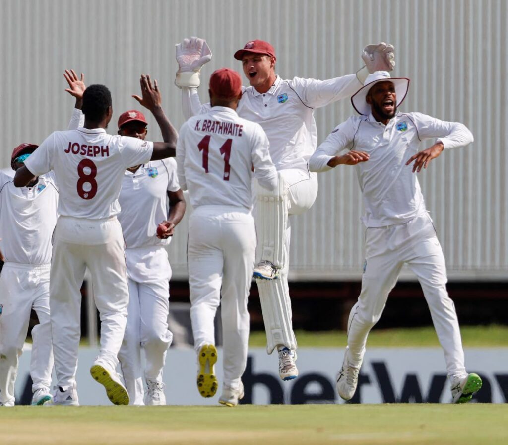 West Indies wicketkeeper Joshua Da Silva, second from rght, celebrates a wicket with his teammates during the 1st Test against South Africa, at Supersport Park in Centurion on February 28. - AFP