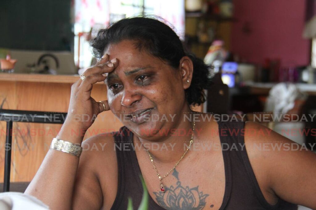 DEEP SORROW: Quanda Maharaj speaks on Monday about her common-law husband Anil Alladin who was found dead in a chair on Sunday at a friend's home in Fyzabad. PHOTO BY MARVIN HAMILTON - 