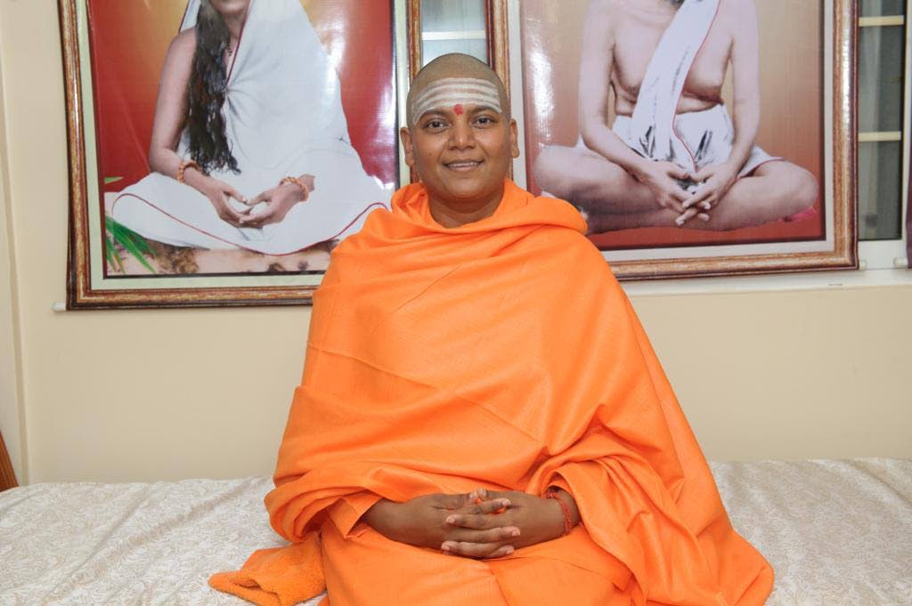 Sadhvi Ananda after her initiation ceremony. Part of the tradition when initiated into the path of Sannyas is to shave one’s head and wear new orange clothes. Photo courtesy Sadhvi Anandamaiyee Giri - 