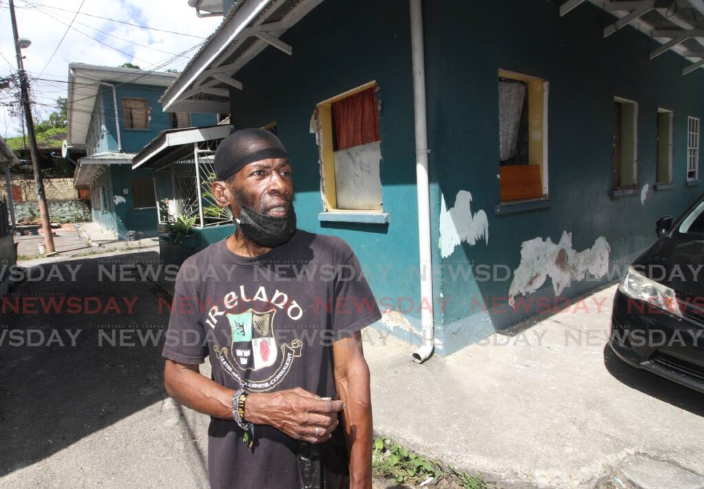 BACK AT HOME: David Yorke at his Duncan Street, East PoS HDC apartment home on Monday, after the HDC gave a one-week extension of its eviction notice to tenants. PHOTO BY ANGELO MARCELLE - 