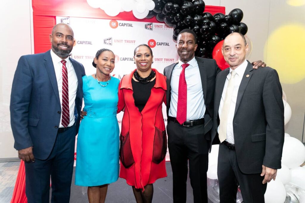 UTC chairman Jo-Anne Julien (second from left), and executive director Nigel Edwards (second from right) are all smiles with GK Group CEO Don Wehby (right), GK Financial Group deputy CEO Steven Whittingham (left) and GK Capital Management managing director Patsy Latchman-Atterbury (centre) after the official Product Launch and partnership of GK Mutual Funds on Monday. - Photo courtesy Keon Predi Photography