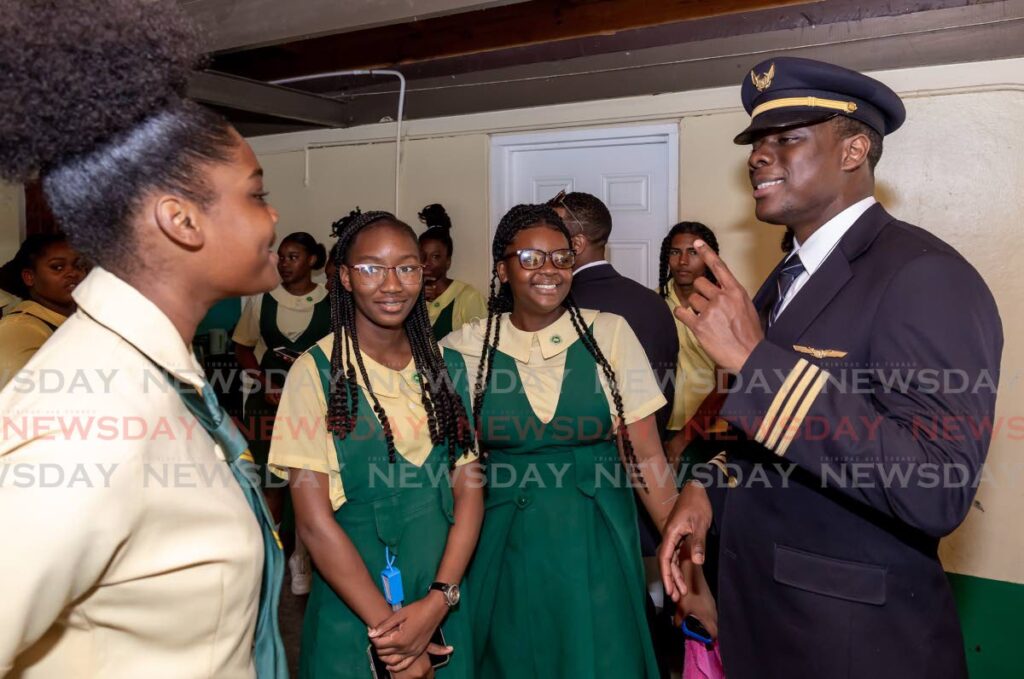 Jerome Lawrence, first officer, United Airlines, gives advice to students of Signal Hill Secondary School, Tobago, during a motivational event on March 8. - DAVID REID