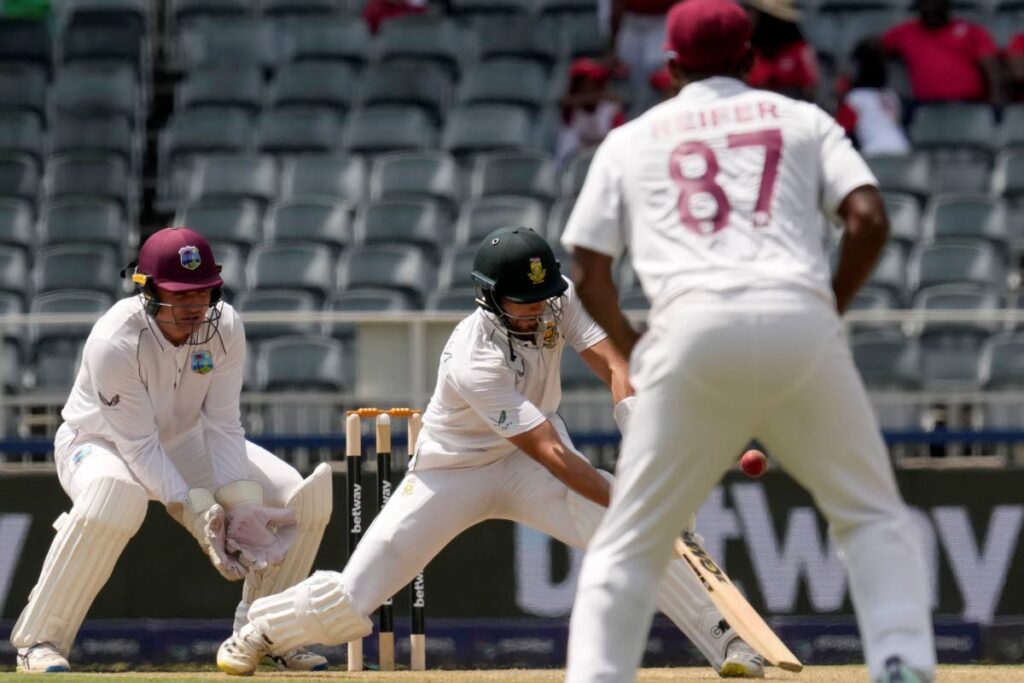 South Africa's batsman Aiden Markram plays a reverse shot as West Indies's wicketkeeper Joshua Da Silva watches on during the first day of the second Test, at the Wanderers Stadium in Johannesburg, South Africa, Wednesday,  - AP PHOTO