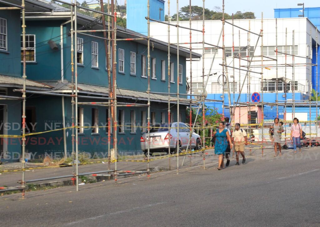 TO BE DEMOLISHED: Scaffolding surround the HDC's housing complex on Duncan Street in East Port of Spain on Wednesday, the latest indication of the buildings being earmarked for demolition. PHOTO BY AYANNA KINSALE - 