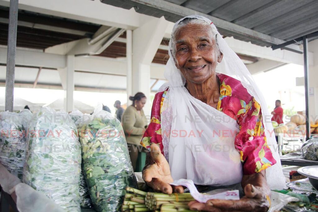 Ramraje Ramsawak at her stall at the Soutern Wholesale Market, in Debe on March 9.  - Lincoln Holder