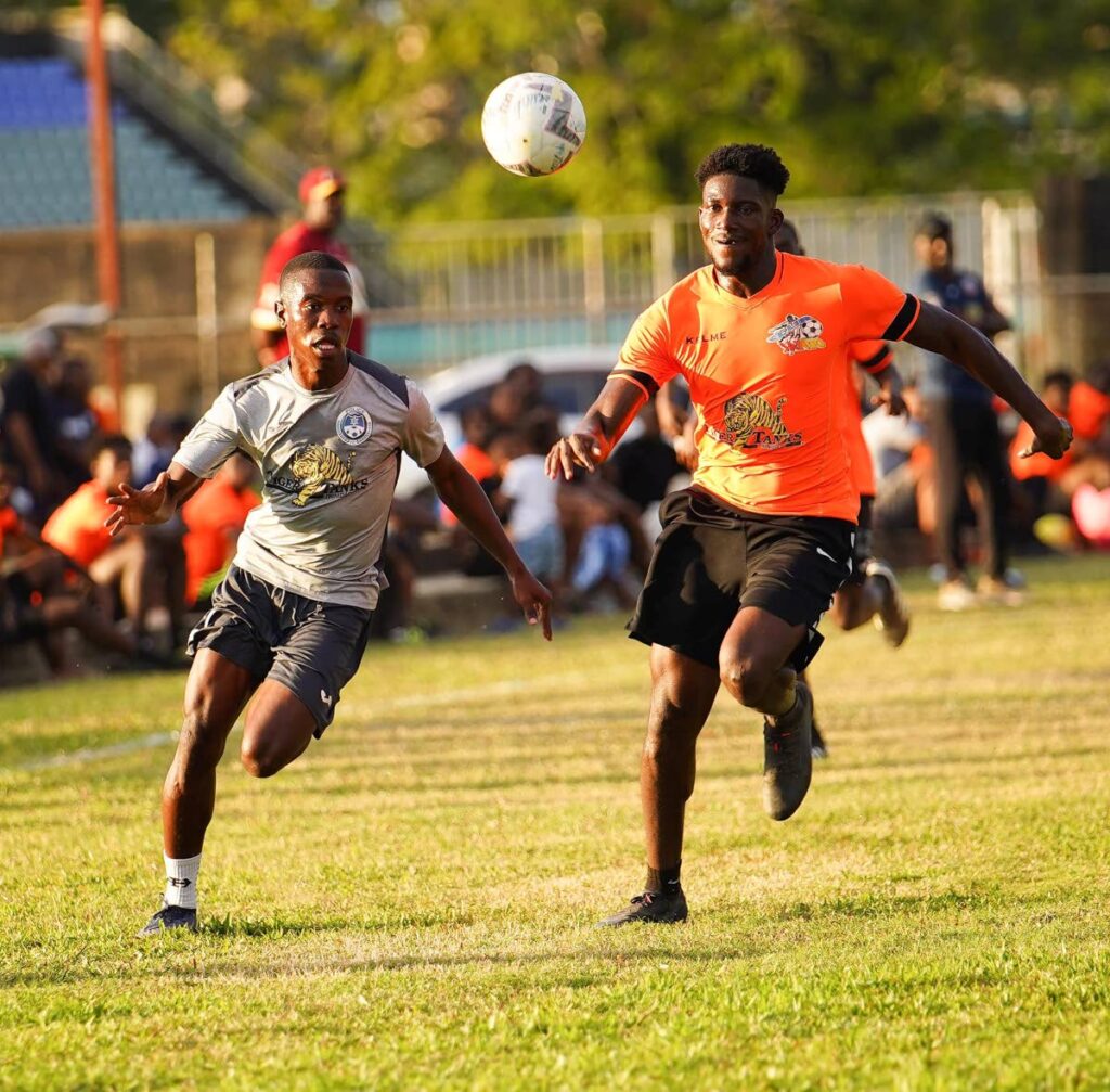 Police FC (grey) and Club Sando faced off in a recent warm-up match ahead of the kick off of the new TT Premier Football League last Friday. Police FC face W Connection, on Friday, at the Police Barracks, St James. - TT Premier Football League