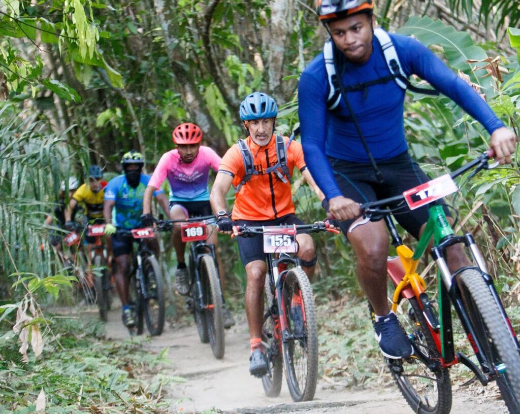 Mountain bikers in action at the Rainbow Warriors Triathlon Club’s 16th edition of the River Raid Mountain Bike, Trail Run and Doggy Run at Samaan Park, Chaguaramas last weekend. - 