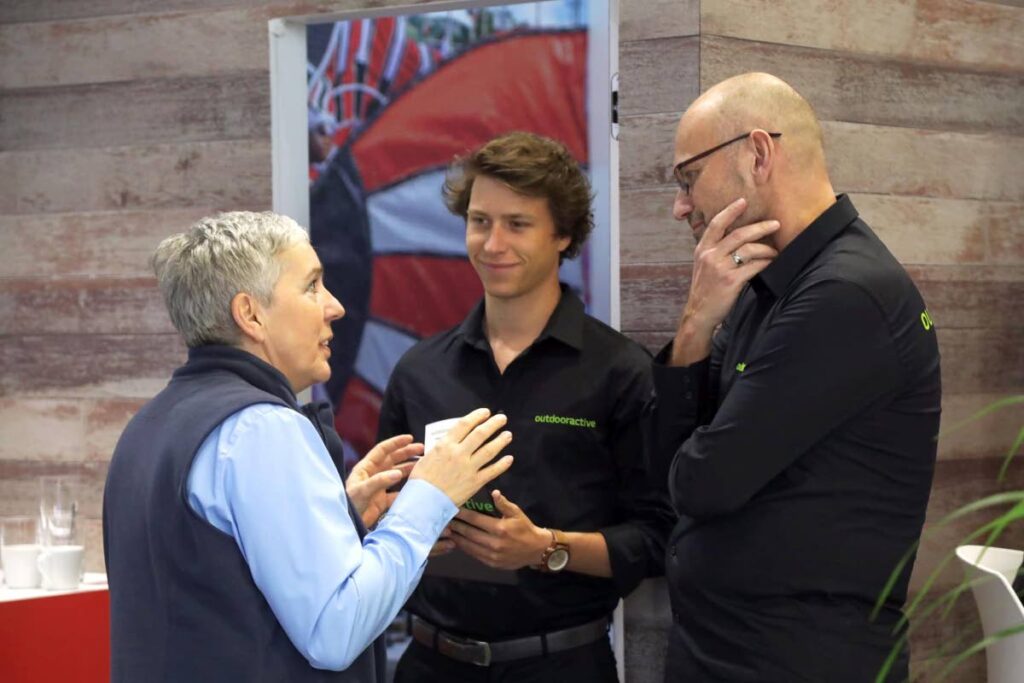 Outdoor Active Account Manager Mike Sandberg, right, and his colleague chat with TTAL's German representative at the ITB Angelika Wegner - 