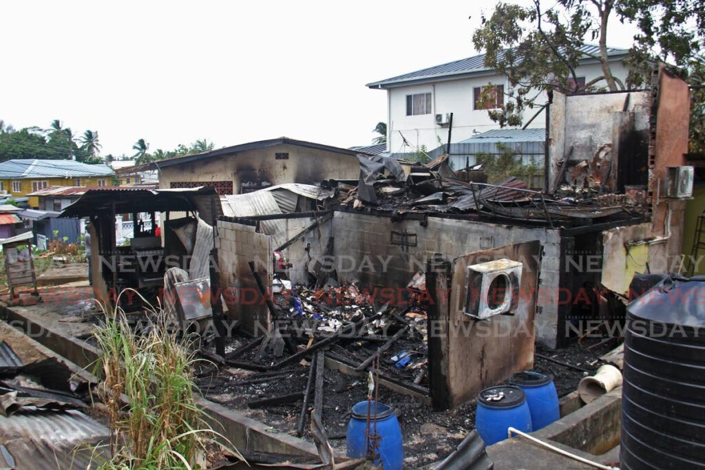 Marabella residents, lost their home to fire on Sunday night in Jack Street.  - Photo by Marvin Hamilton