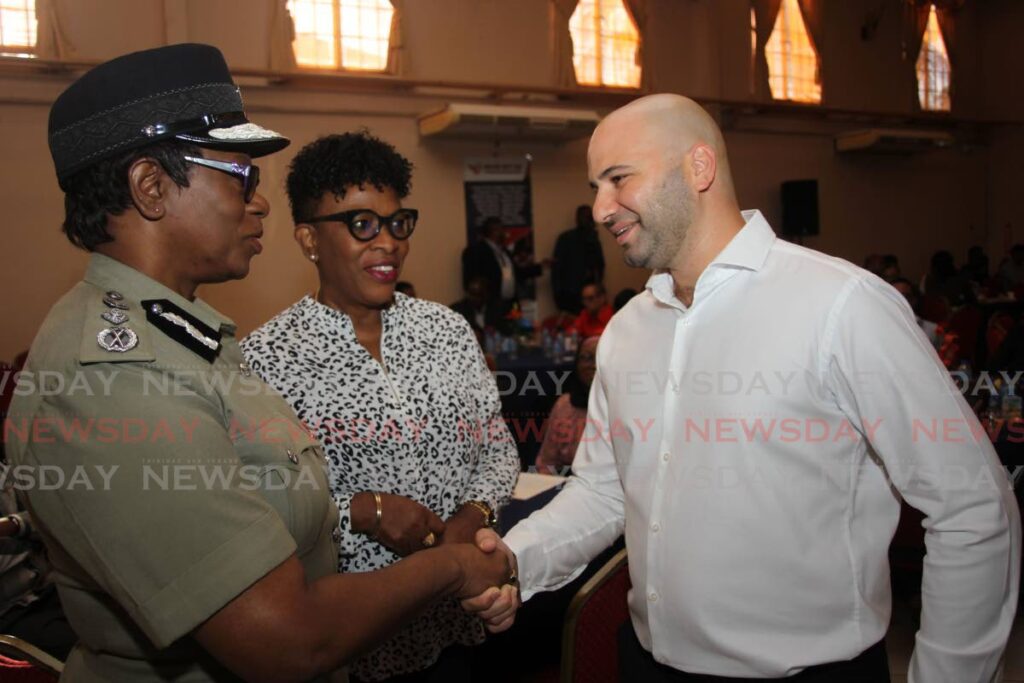 Managing director at AE Tactical Luke Hadeed greets  Commissioner of Police Erla Harewood-Christopher, left, while police corporate communications manager Joanne Archie looks on during a breakfast meeting held by the Chaguanas Chamber of Industry and Commerce at Signature Hall, Chagaunas on Wednesday. - Photo by Lincoln Holder