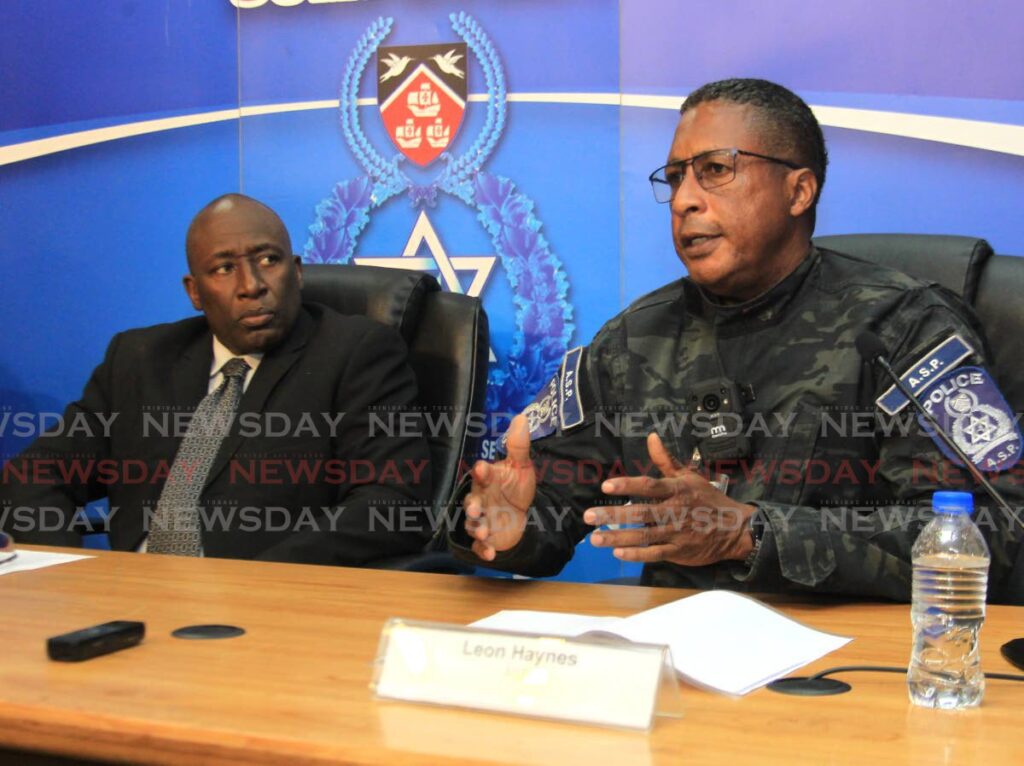 ASP Leon Haynes of the Multi-Agency Task Force, right, and acting deputy commissioner Curt Simon during a press briefing, at Police Administration Building, on March 16. - AYANNA KINSALE