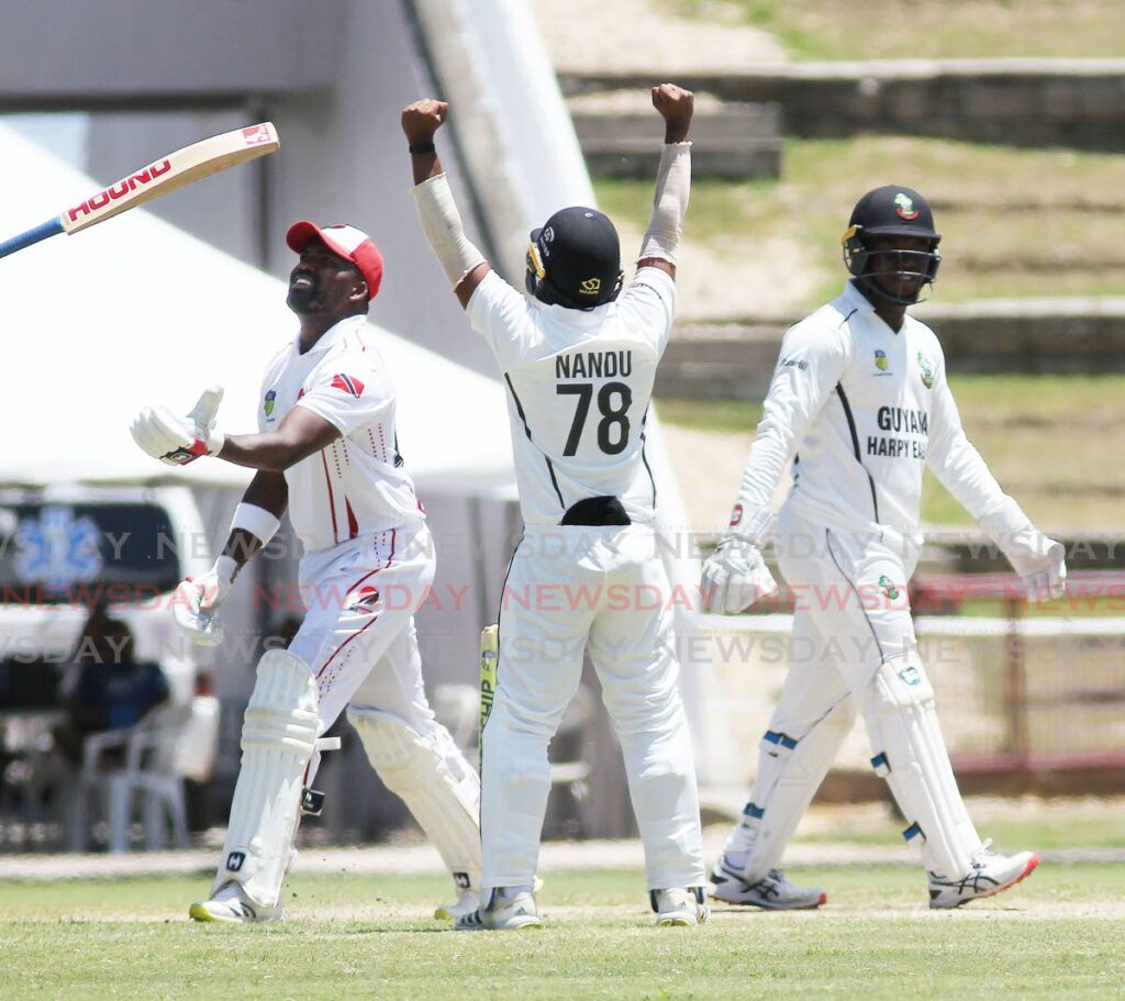 TT Red Force skipper Darren Bravo tosses his bat in frustration after being caught out against the Guyana Harpy Eagles in the  West Indies Four Day Championships at the Brian Lara Cricket Academy, on Saturday. - Lincoln Holder