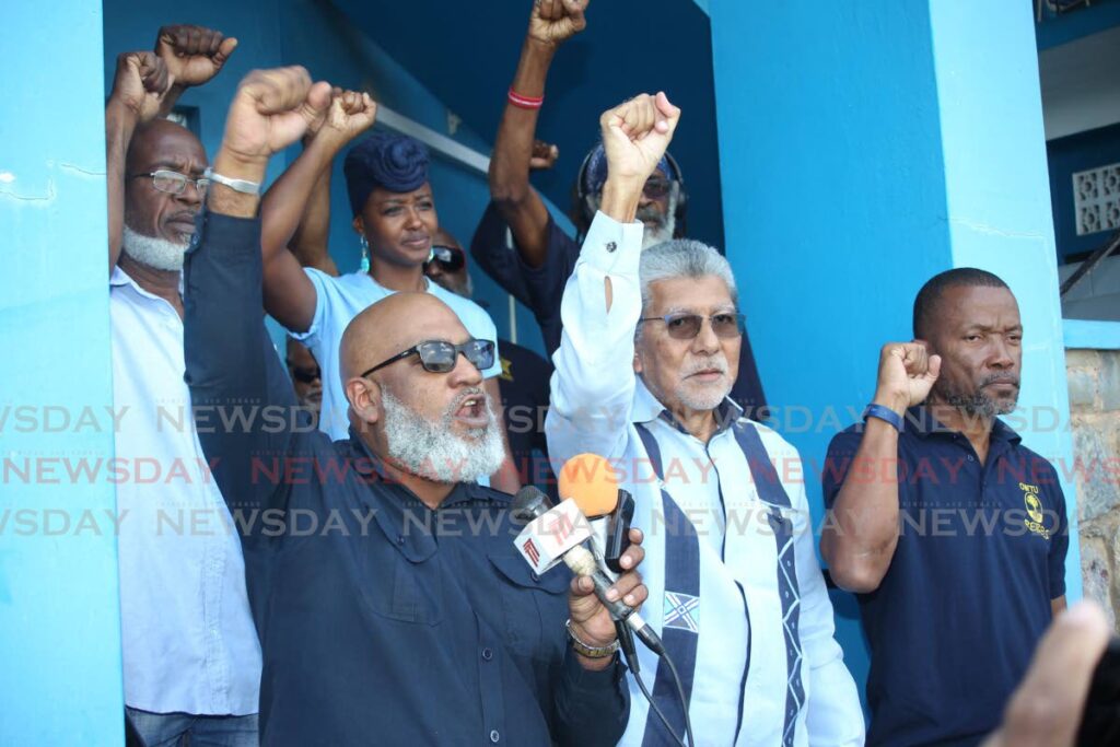Ozzi Warwick, chief education and research officer at the OWTU alongside political leader of the MSJ David Abdulah speak from the steps of the OWTU's headquarters at Paramount Building, San Fernando, on Saturday. - Lincoln Holder