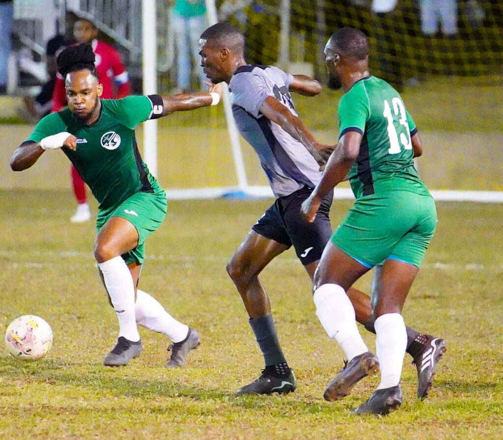 W Connection (green) defeated Police FC (grey) 2-1 during the TT Premier Football League match, on Friday, at Police Barracks, St James. - via TTPFL