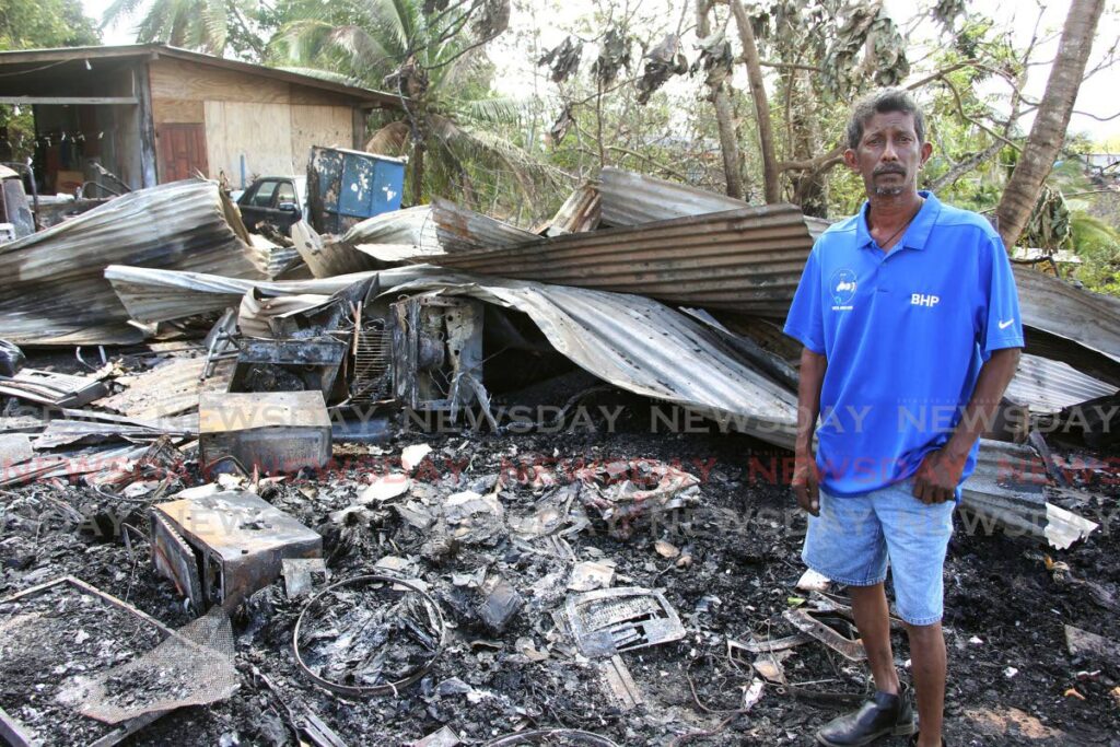 Brothers Toolsie Ramdass-Singh is now homeless as a bush fire spread to and destroyed his home at Soledad Road, North Claxton Bay, on Saturday. - Lincoln Holder