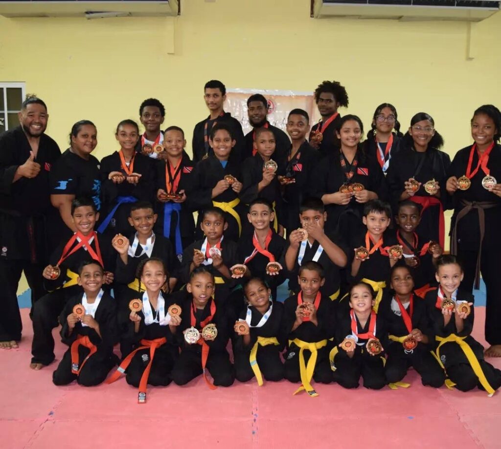 Team Elite Karate with their medals from the Tatami Open Championship. - 