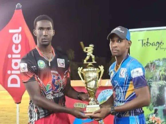 Dejourn Charles, and Jahron Alfred with the 2022 Chief Secretary Bago T10 championship trophy. - 