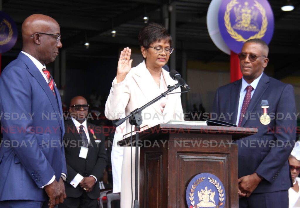 President Christine Kangaloo takes her oath of office on Monday flanked by Prime Minister Dr Keith Rowley, left, and Chief Justice Ivor Archie, at the Queen’s Park Savannah, Port of Spain. - Photo by Ayanna Kinsale