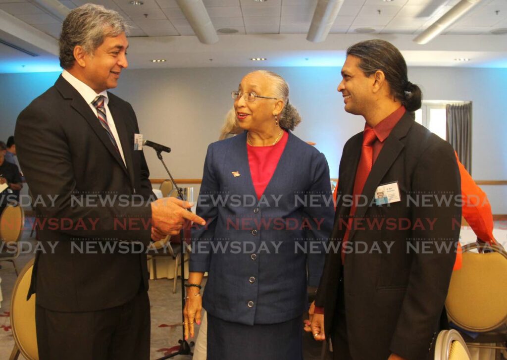 National Trust chairman Margaret McDowall, centre, with Kishan Kumarsingh, left, of the Ministry of Planning and Development and aquatic ecologist Dr Ryan Mohammed at the trust's Keeping History Above Water workshop at the Hyatt Regency on Tuesday. PHOTO BY AYANNA KINSALE - 